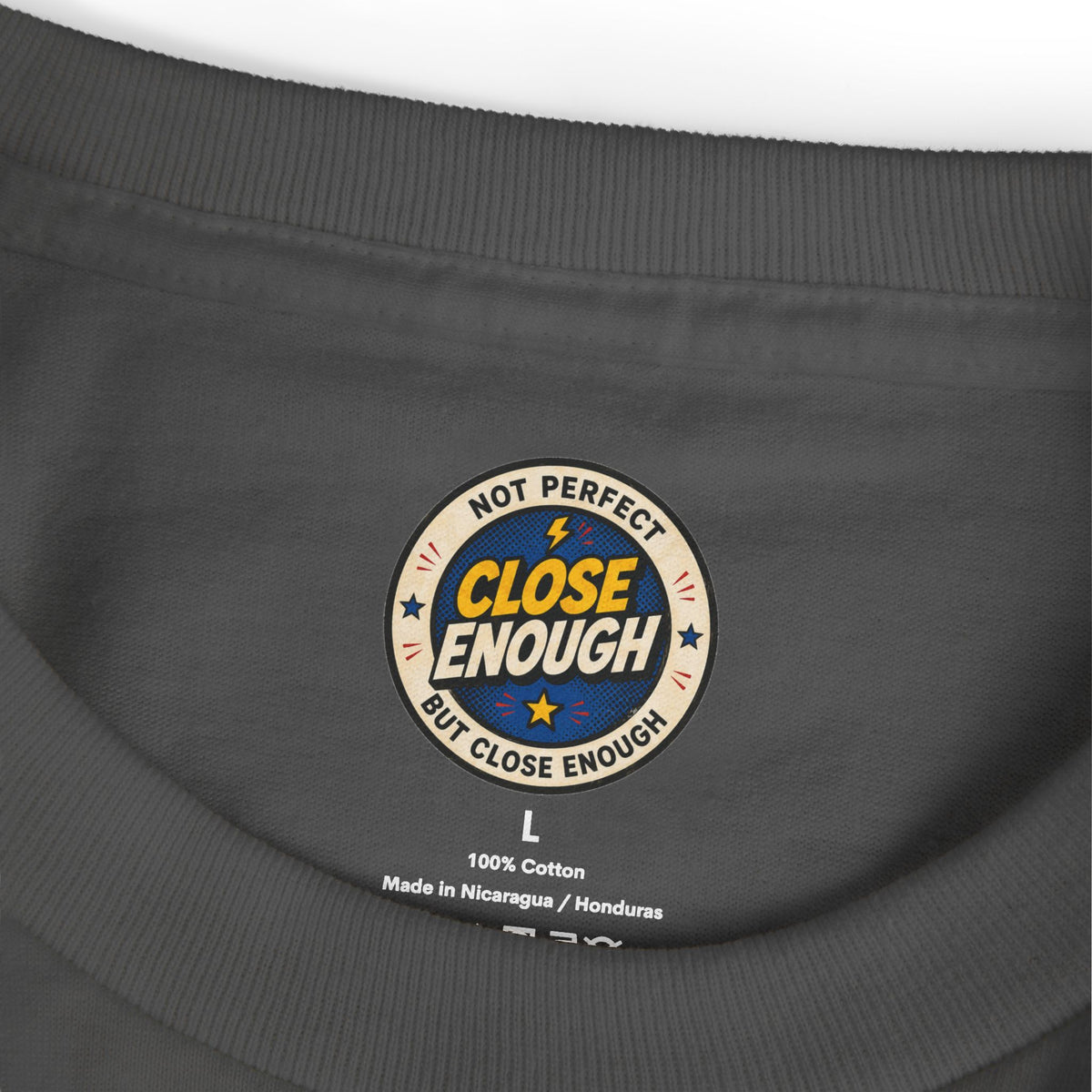 CLOSE ENOUGH neck label on the LOWTIVATION garment-dyed tee
