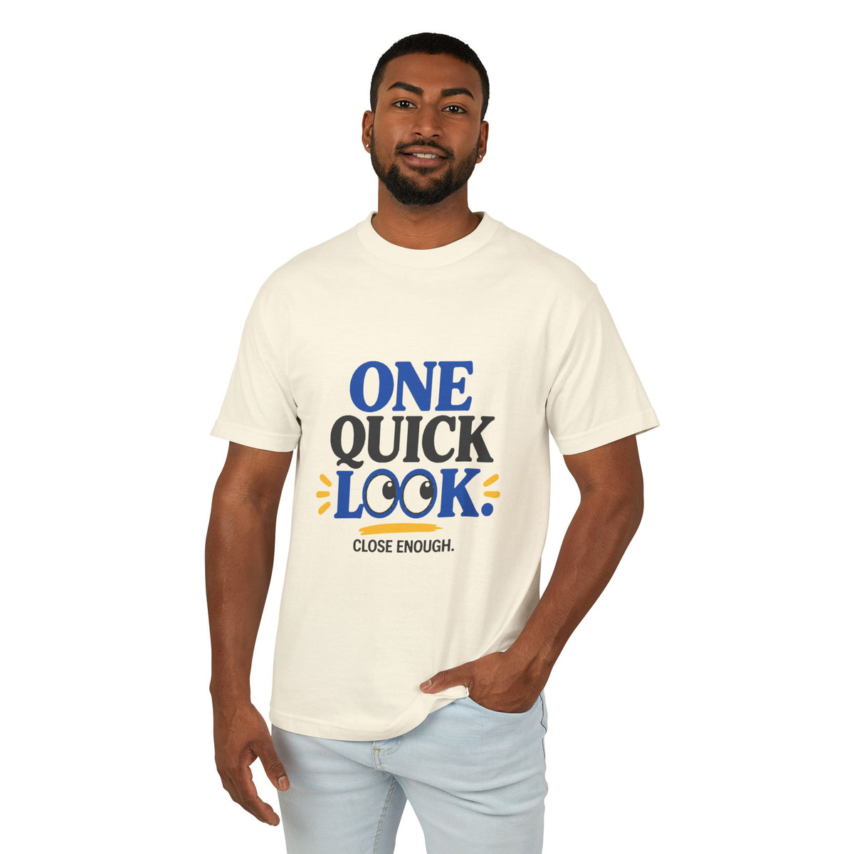 Male model wearing the Close Enough One Quick Look Tee in Faded Cream, front view