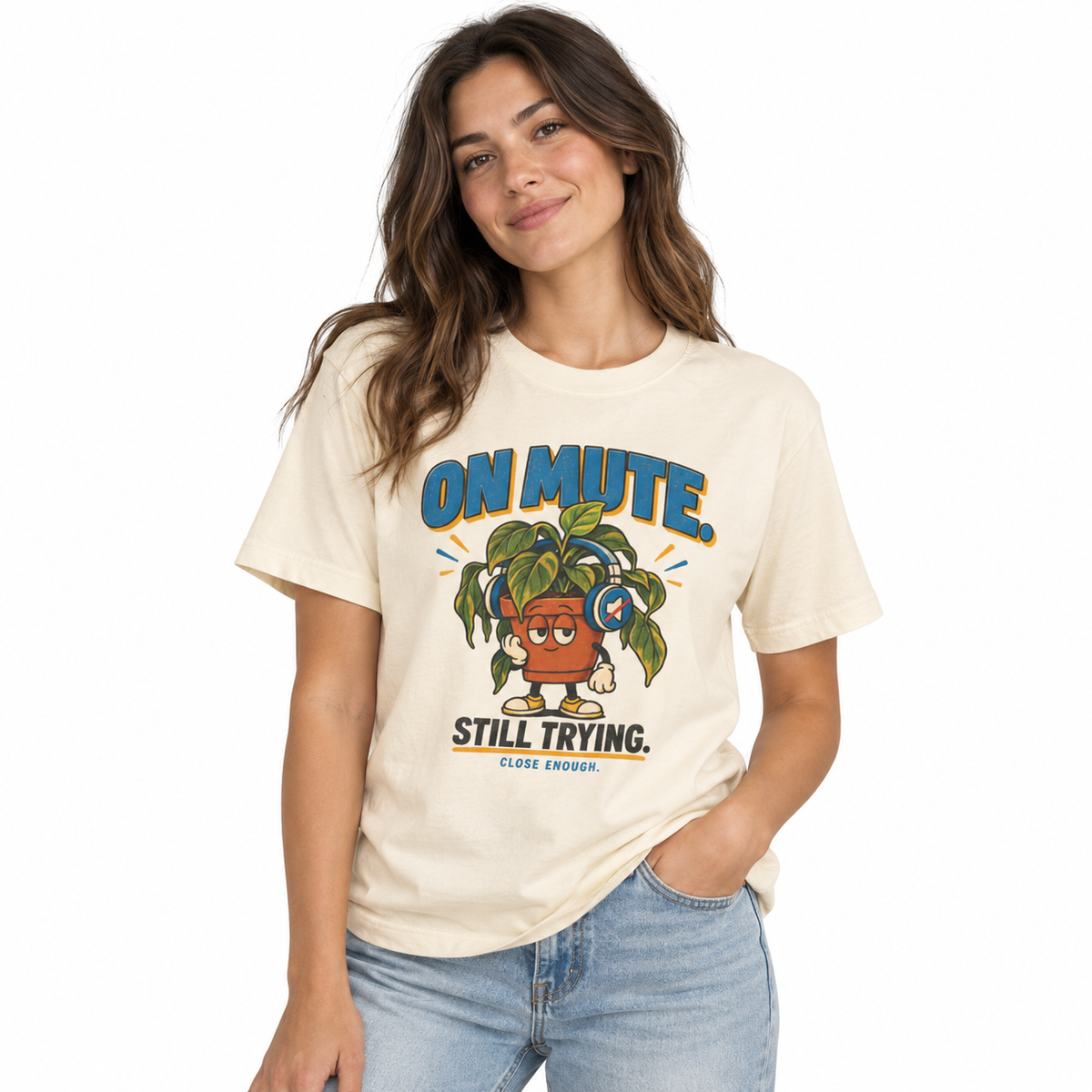 Woman wearing the ON MUTE tee in Faded Cream