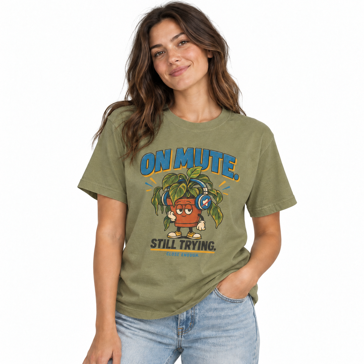 Woman wearing the ON MUTE tee in Faded Army