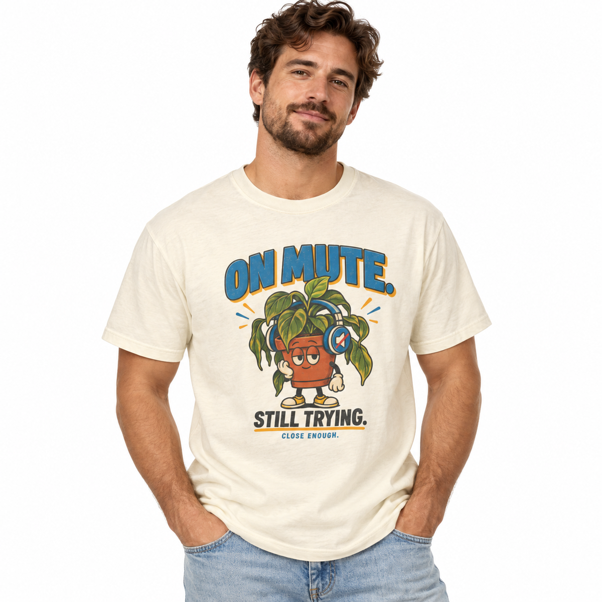 Man wearing the ON MUTE tee in Faded Cream