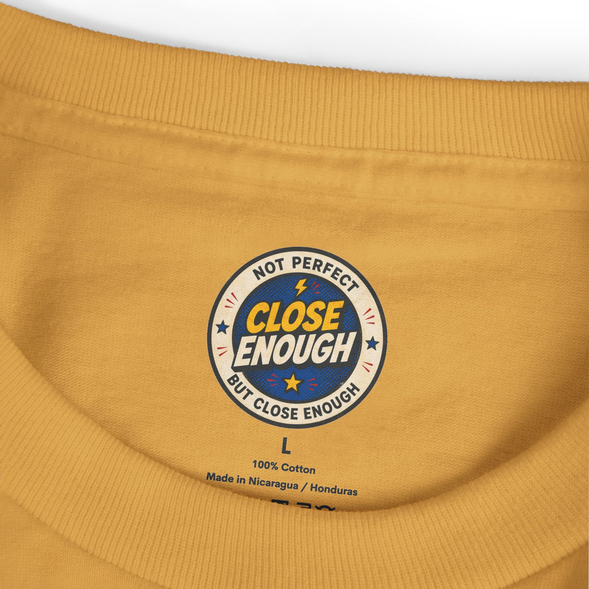 CLOSE ENOUGH neck label on Faded Mustard tee