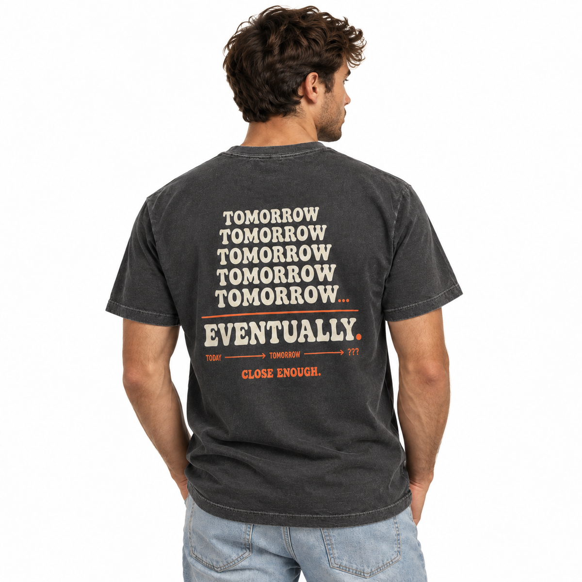 Man wearing the I'll Do It Tomorrow faded black tee showing back artwork