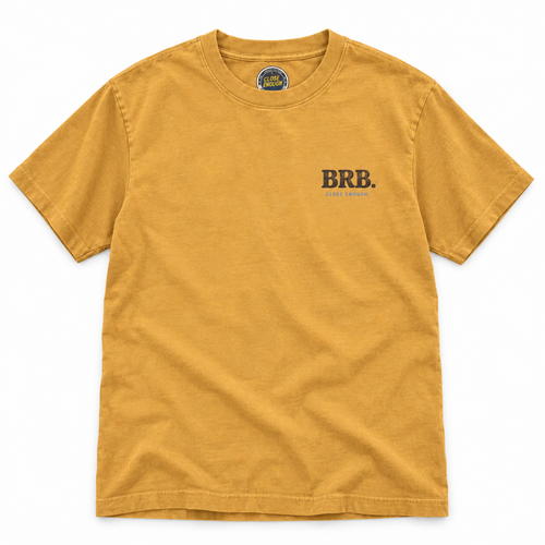 BE RIGHT BACK faded mustard graphic tee with small front chest print