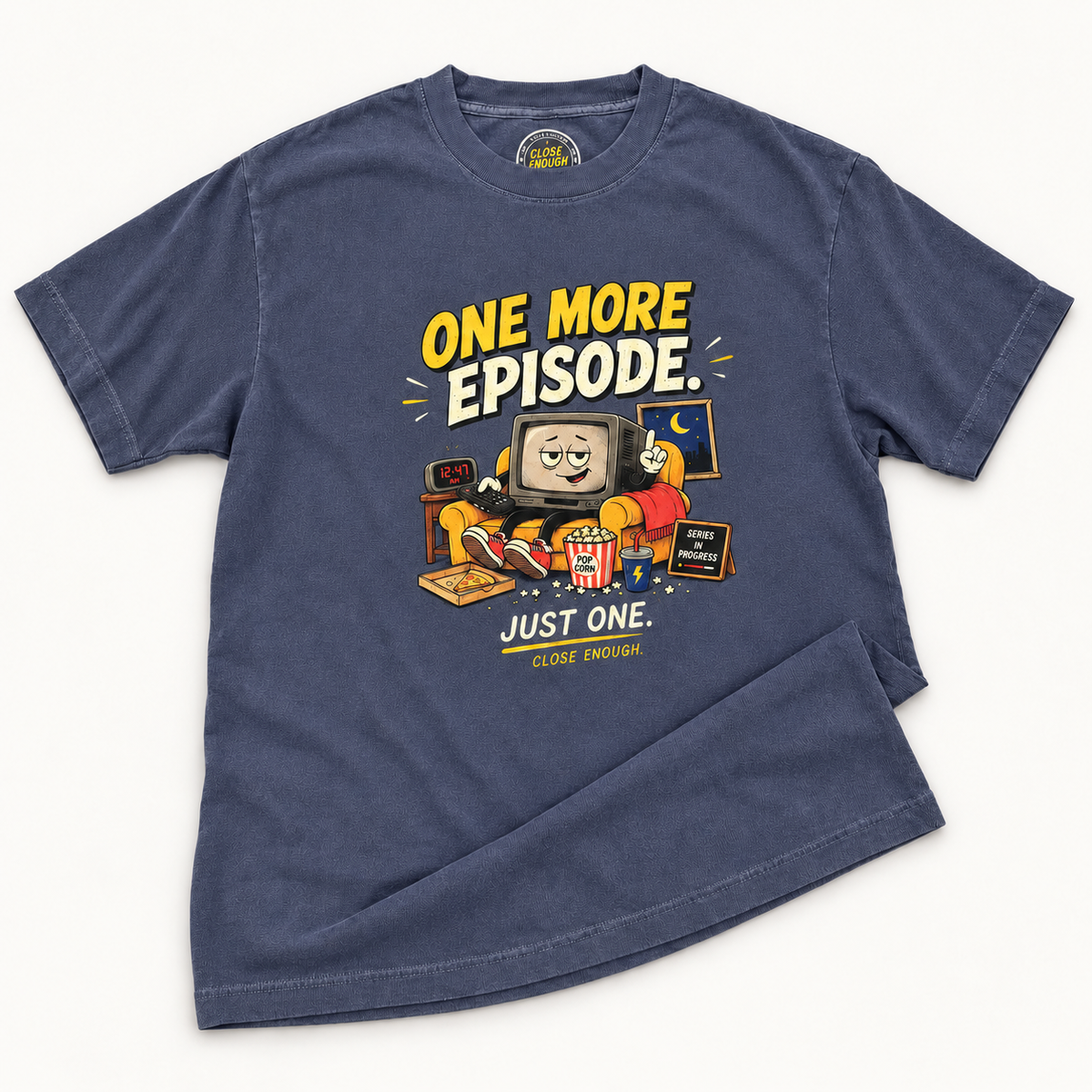 One More Episode Tee real product sample in faded navy showing the printed graphic and garment-dyed fabric